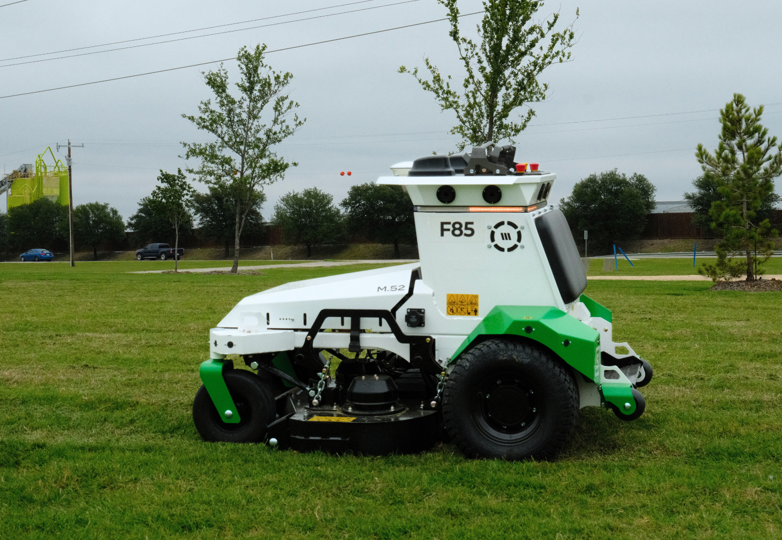 Automatic Scythe robotic mower performing commercial grass mowing at a Site Landscape Development property