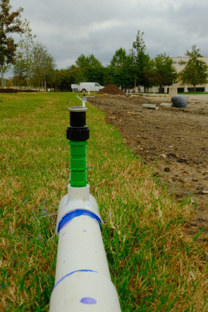 New sprinkler head installed as part of commercial irrigation system