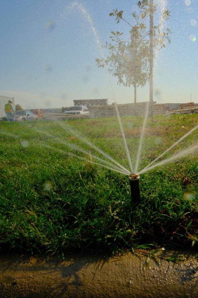 Newly installed irrigation sprinklers at a commercial property