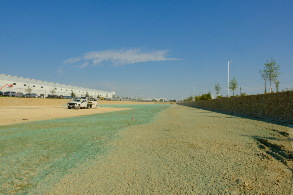 Hydromulch being sprayed at large commercial construction site