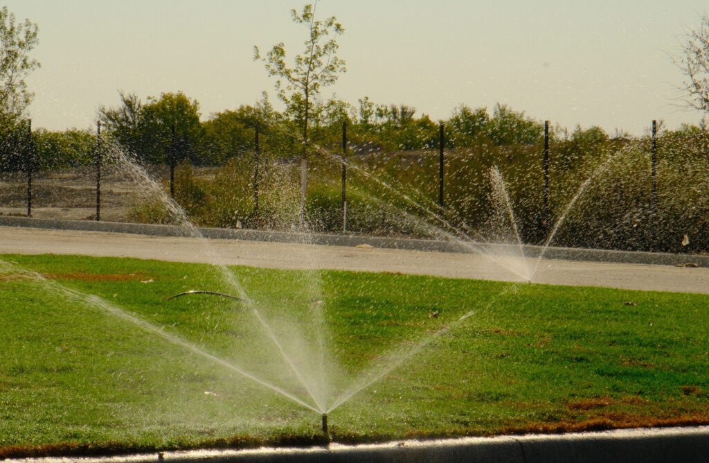 Newly installed irrigation sprinklers at a commercial property.