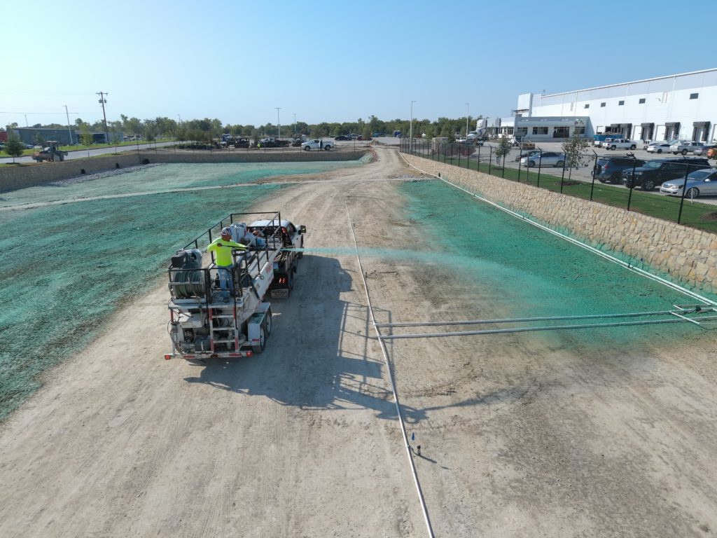 Hydromulch application across a large commercial parking lot project in the DFW area.