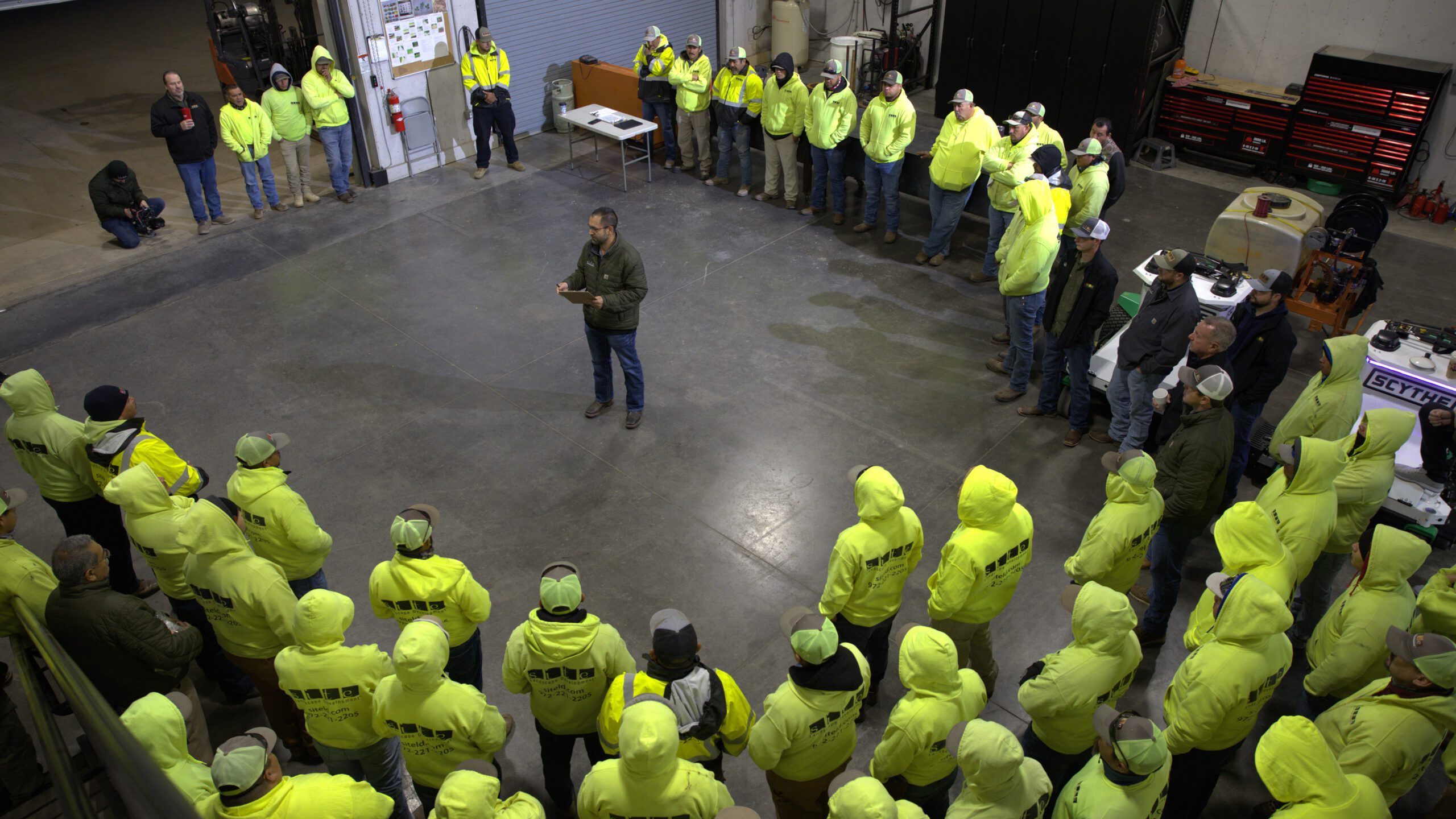 SLD team gathered for a crew meeting at the company shop before the workday.
