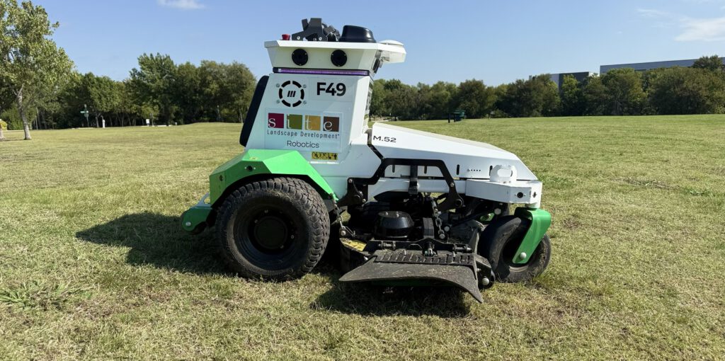 Automatic Scythe robotic mower performing commercial grass mowing at a Site Landscape Development property