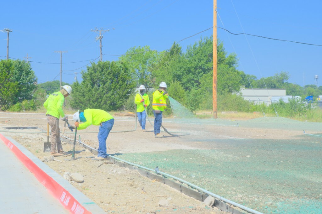 SLD crew members spraying hydromulch at an industrial development in Fort Worth, TX.